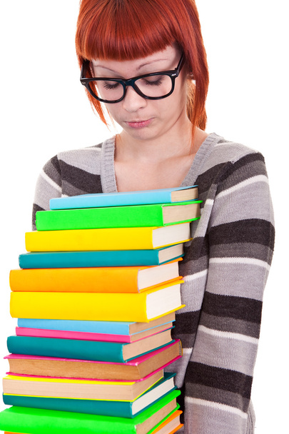 Sad school girl with stack color books - Foto, imagen
