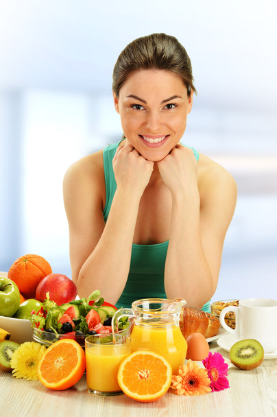 Young woman having breakfast. Balanced diet  - Fotó, kép