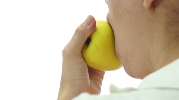 Female Eating Apple Over Shoulder - Filmati, video