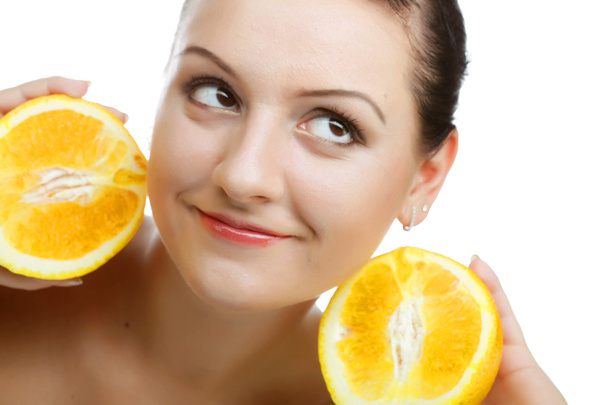 woman with oranges in her hands - 写真・画像