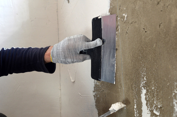 Процес шпаклівки бетонної стіни
  - Фото, зображення