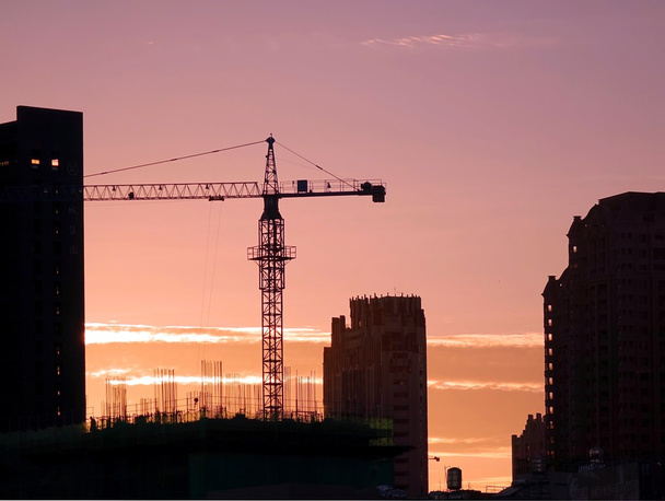 Busy City Construction Site at Sunset - Photo, Image