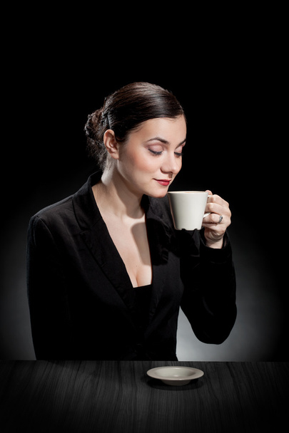 beautiful girl enjoying a cup of coffee - Fotó, kép