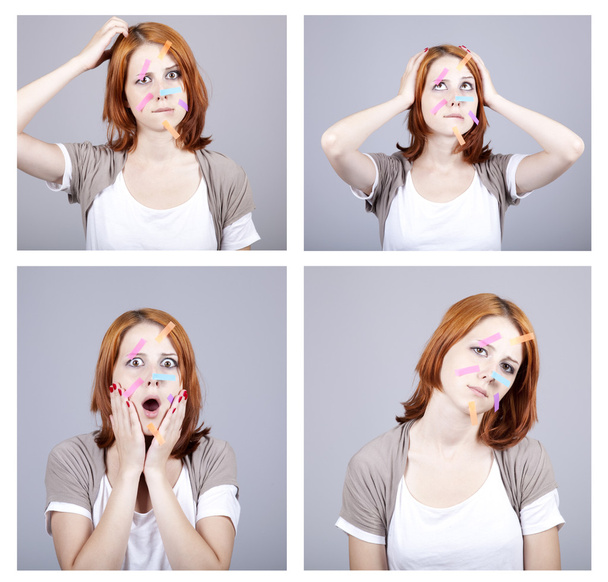 4 confused redhead businesswomen with notes on face. - Photo, Image