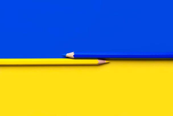 Flag of Ukraine with blue and yellow pencil with copy space - Photo, image