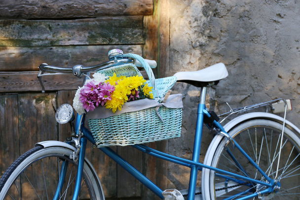 Old bicycle with flowers - Фото, изображение