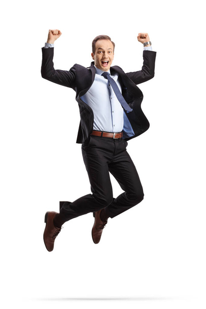 Emocionado hombre de negocios saltando aislado sobre fondo blanco - Foto, imagen