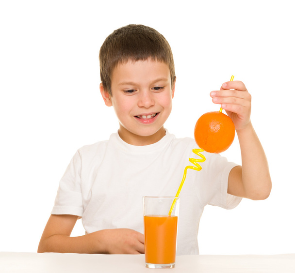 boy drink orange juice with a straw - Zdjęcie, obraz