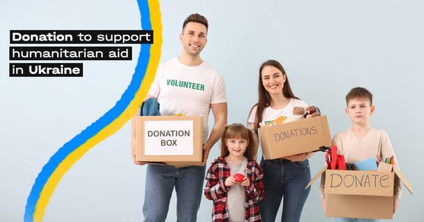 Volunteers with donation boxes and ribbon in colors of Ukrainian flag on light background. Humanitarian aid for Ukraine - Photo, Image
