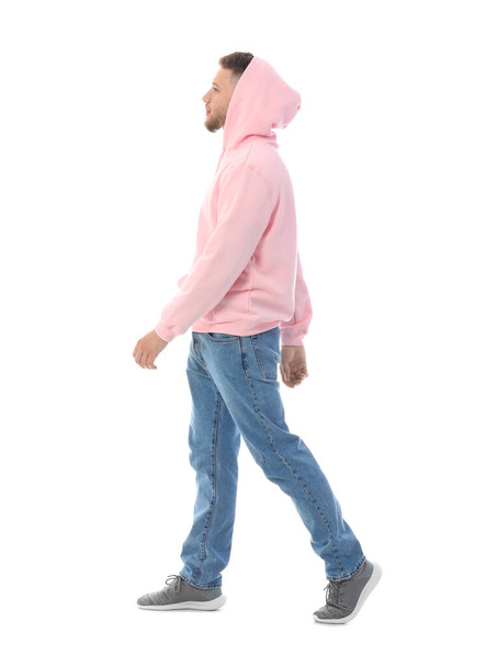 Young guy in stylish hoodie on white background - Фото, зображення