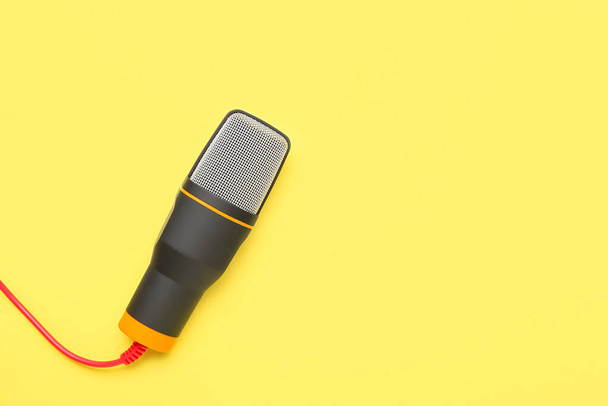 Modern microphone on yellow background - Photo, Image