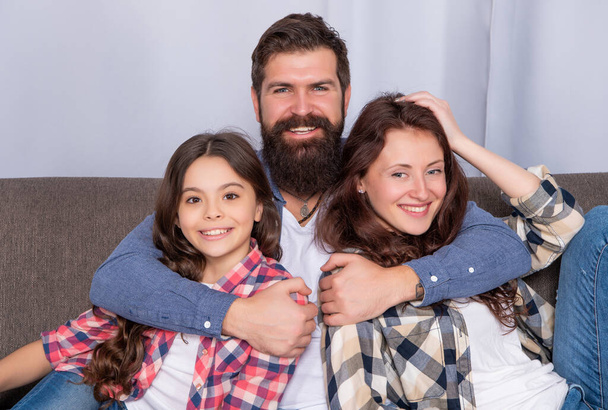 happy parents with kid spend time together at home, family - Photo, Image
