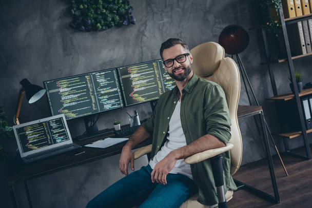 Portrait of attractive cheery skilled guy developing web project intranet remote support at work workplace workstation indoors - Фото, зображення