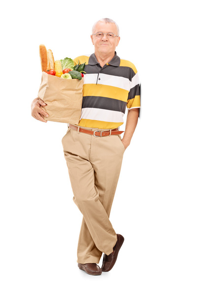 Gentleman with bag full of groceries - Фото, зображення