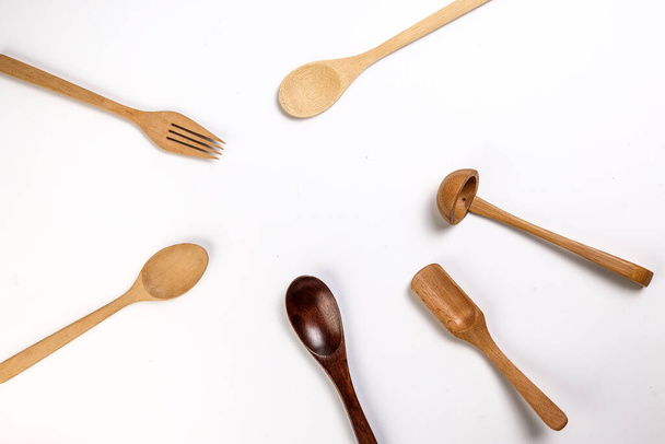 Varity of wooden metal plastic spoon kitchen tableware on white background copy text space - Valokuva, kuva