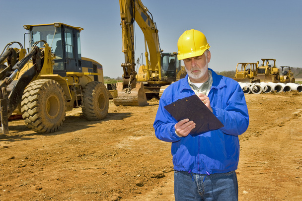 Foreman Keeping Records On Job Site - Photo, image