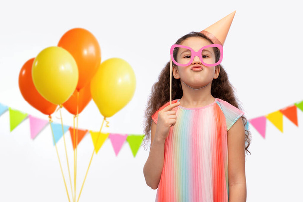 little girl in birthday party hat with glasses - Photo, image