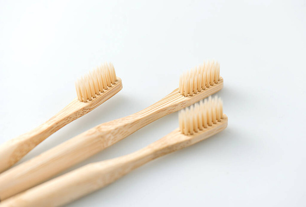wooden toothbrushes on white background - Фото, изображение