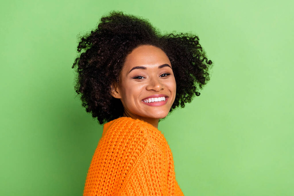 Profile photo of sweet young volume hairdo lady wear orange sweater isolated on green color background - Photo, Image