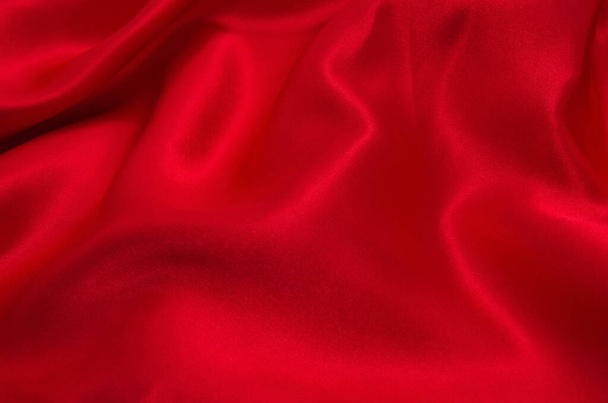 Κόκκινο σατέν ή μεταξωτό ύφασμα ως φόντο - Φωτογραφία, εικόνα