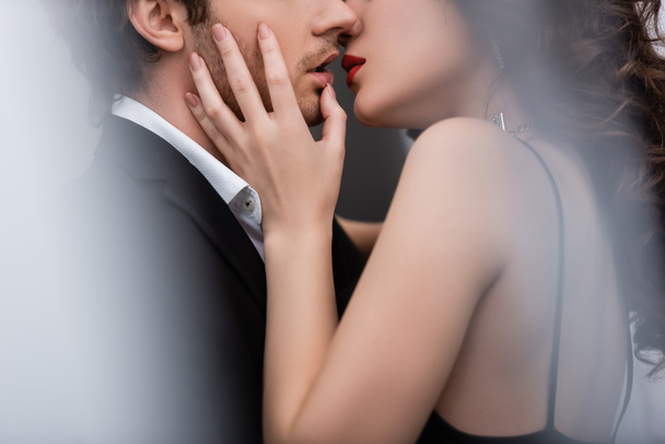 cropped view of sexy and young woman kissing with man - Photo, Image