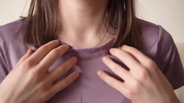 Teenage girl practicing EFT or emotional freedom technique - tapping on the collarbone point, slow motion - Footage, Video