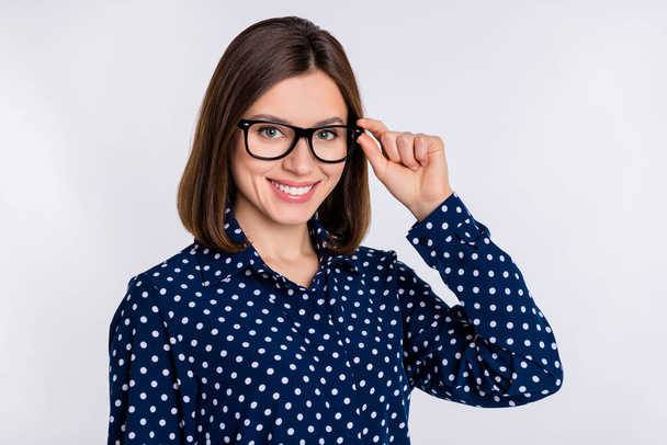 Portrait of attractive cheerful skilled experienced girl expert touching specs isolated over gray pastel color background - Фото, зображення