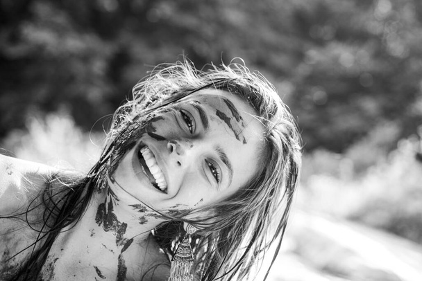 Happy dirty girl face covered in mud. - Φωτογραφία, εικόνα