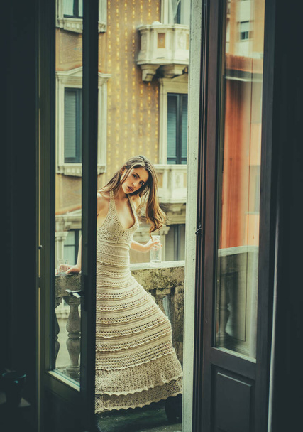 Fashion sensual woman on balcony. Girl outdoor. City portrait. - Zdjęcie, obraz