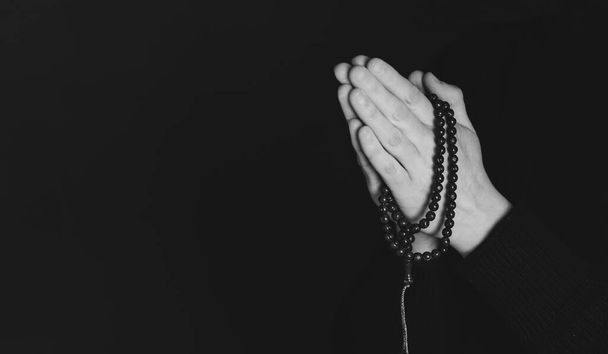 Praying hands with faith in religion and belief in God on dark background. Power of hope or love and devotion. - Foto, Imagem