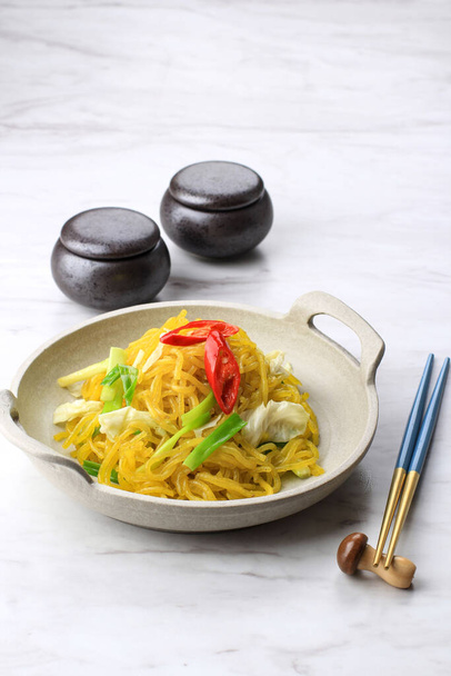 Mie Glosor or Mie Gelososr. Glossy Yellow Noodles popular in Bogor, West Java. Noodles Made from Tapioca or Sagoo Flour (Aci) mixed with Turmeric, Popular Takjil for Breakfasting in Ramadhan. - Photo, Image