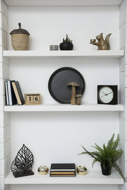 Many shelves with different decor in room. Interior design - Φωτογραφία, εικόνα