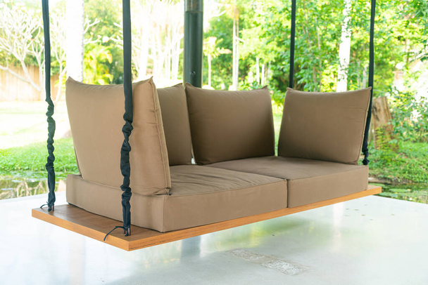 empty sofa swing in garden for relax time - Fotografie, Obrázek