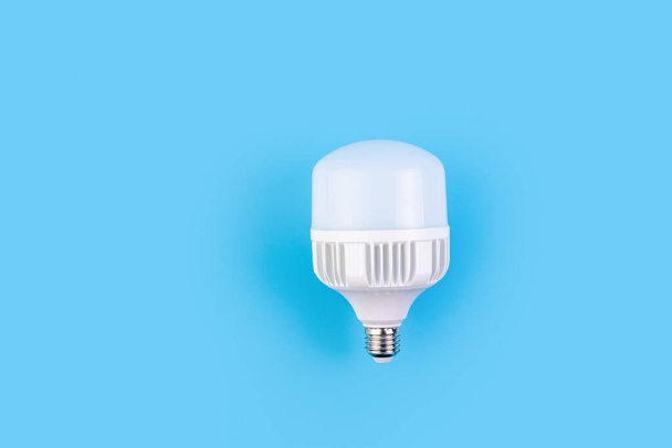 big LED light bulbs on blue color background. Flat lay with copy space. Concept ecology, save planet earth, idea, save energy, economy, saving. Earth day. - Fotó, kép