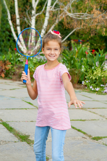 Cute girl with racket Outdoors - Photo, image