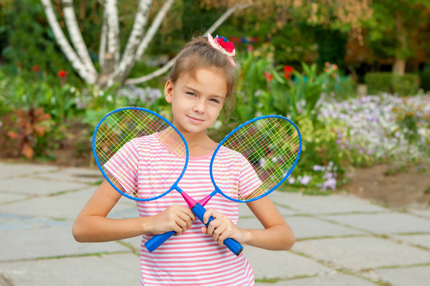 Cute girl with racket Outdoors - Fotoğraf, Görsel