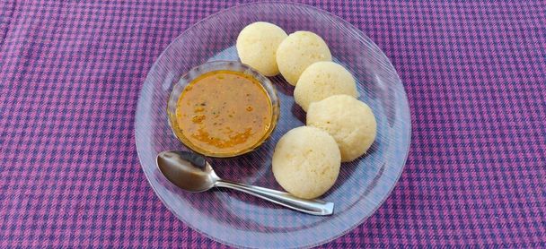Idly sambar or Idli with Sambhar and green sauce. Popular South indian breakfast - Photo, image
