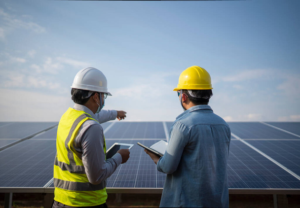 engineer and worker working together in the solar panel power station renewable energy  - Photo, Image