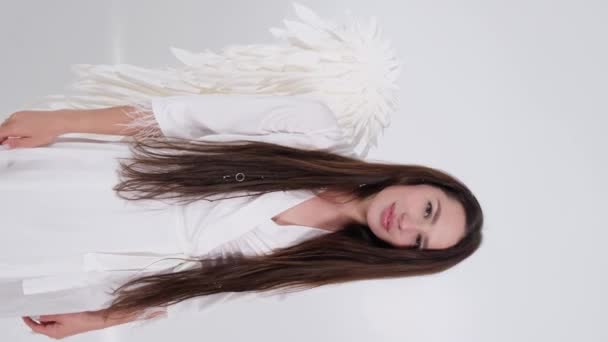 Happy woman with angel wings on a white background.  - Footage, Video