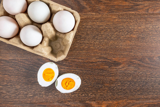 White duck eggs and salted egg food on a wooden table - 写真・画像