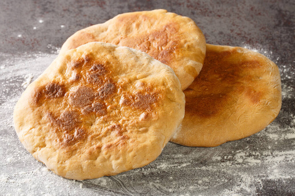 Palyanytsya fragrant Ukrainian bread with a crispy crust closeup in the table. Horizonta - Photo, image