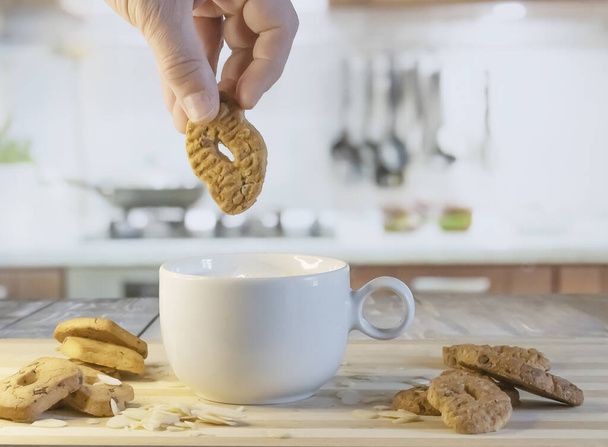 wholemeal milk and cookies on the kitchen table - 写真・画像