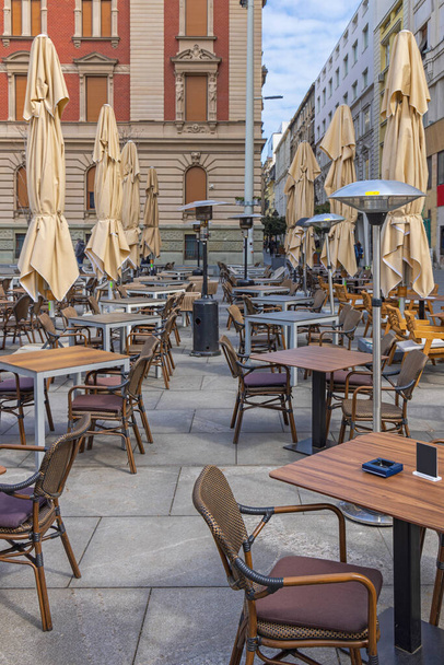 Empty Tables and Chairs at Restaurant Street Terrace Winter Day - Fotó, kép