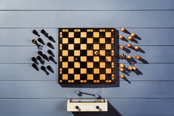 Top view chess board on gray wooden table background - Photo, Image