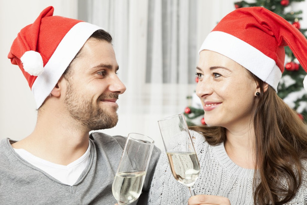 young christmas couple with champagne  - 写真・画像