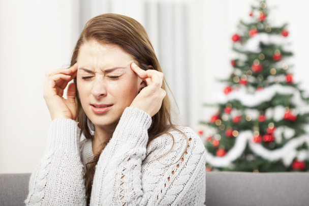 young girl has headache of christmas stress - Photo, Image