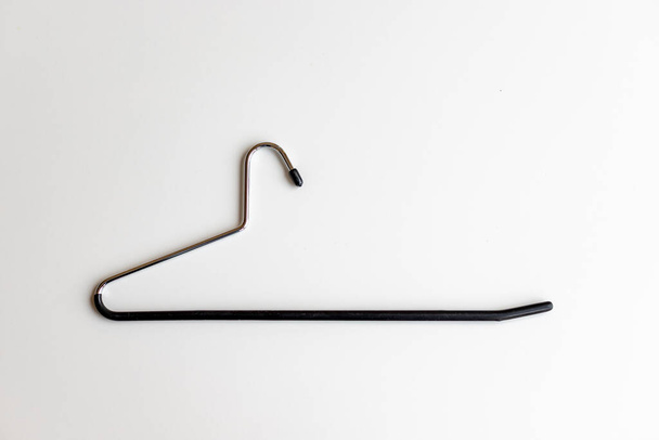 L shape hanger for pants, trousers and jeans on a white background - Foto, immagini