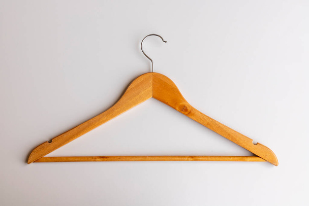 Wooden cloth hanger on white background - Foto, afbeelding