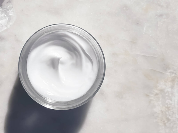 Face cream moisturiser, glass jar on marble stone background, skincare and cosmetic, beauty product concept - Photo, Image