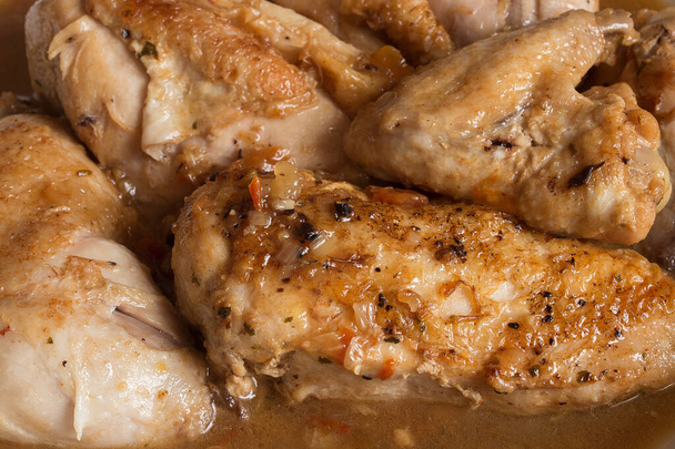 Close-up of chicken in vegetable sauce with cognac.  Meat, and vegetables. Organic texture background. - Photo, Image